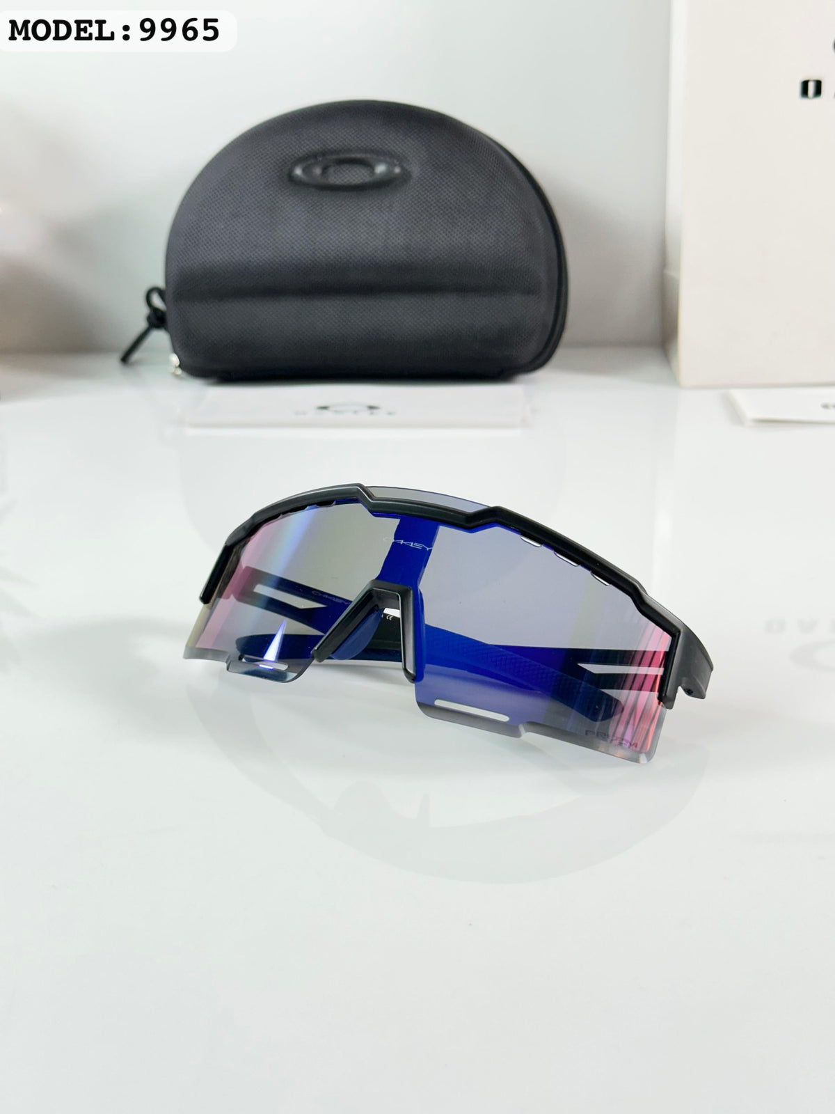 Oakley 9965 Black/Blue Reva